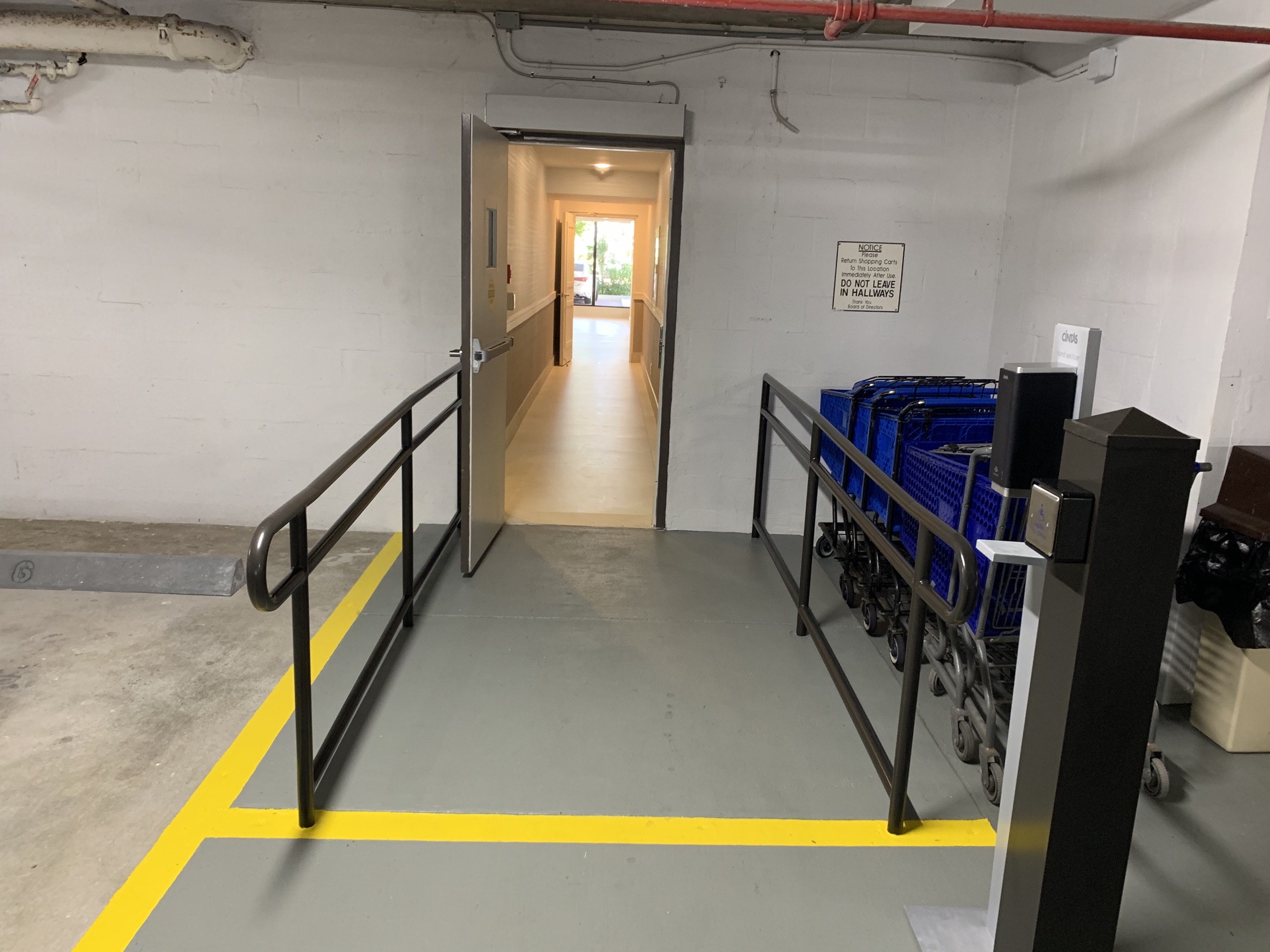 Accessible route and protective railings connecting the Casuarina parking area with the renovated common spaces