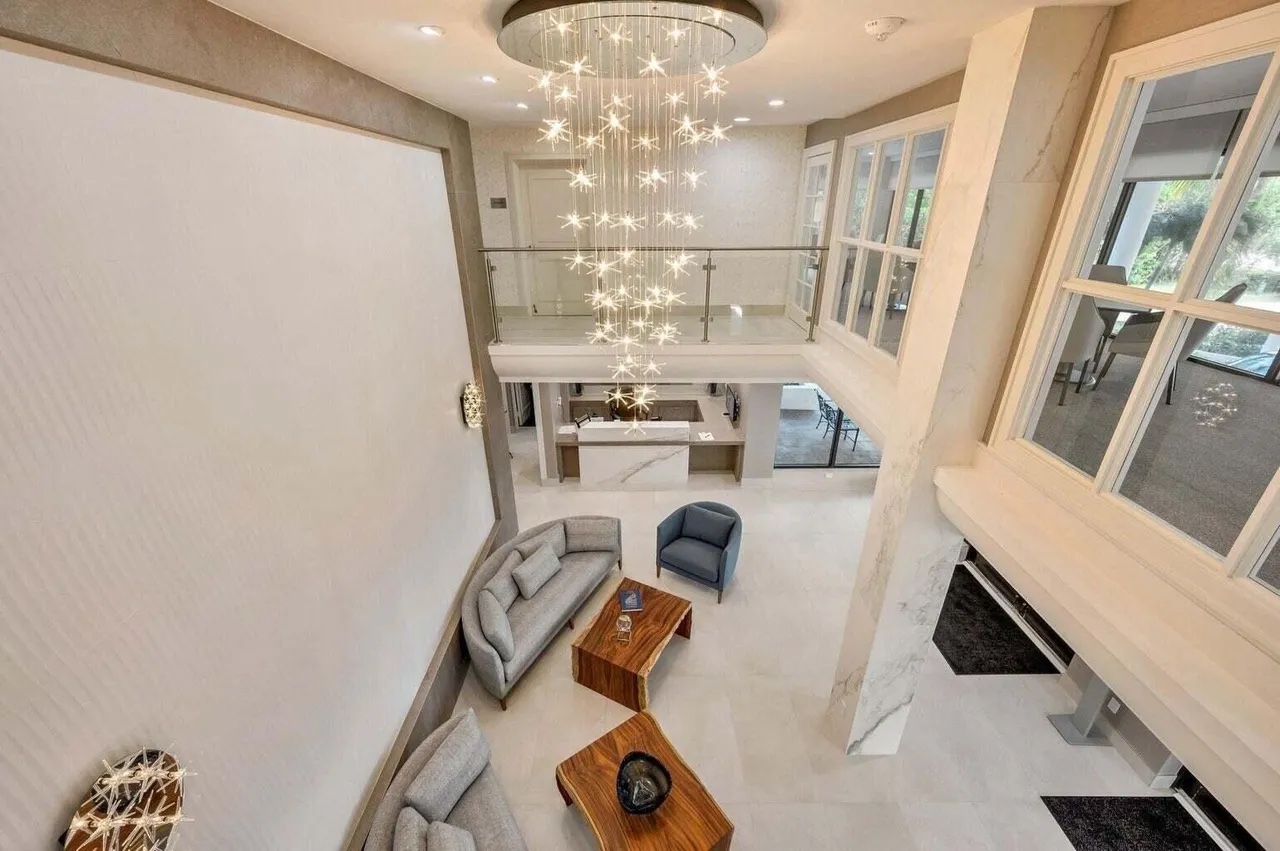 Upper-level view over the Casuarina lobby and its vertical sculptural light installation