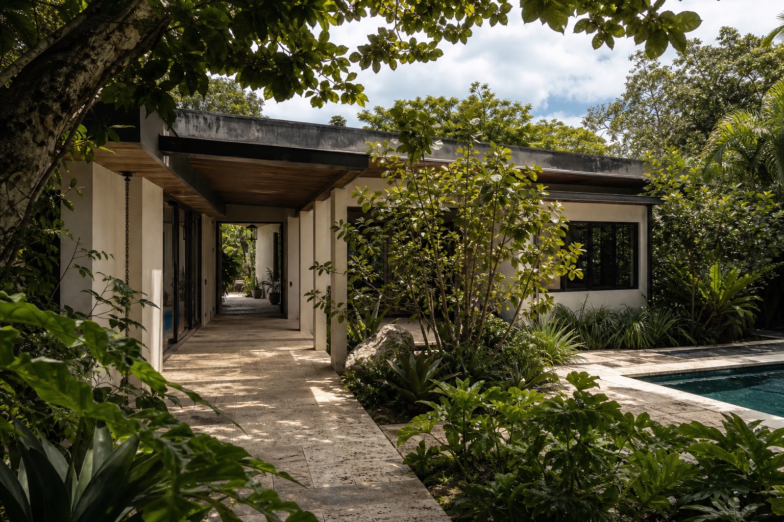 Existing tropical modern Miami house evaluated for shade, orientation, vegetation, drainage and indoor-outdoor performance