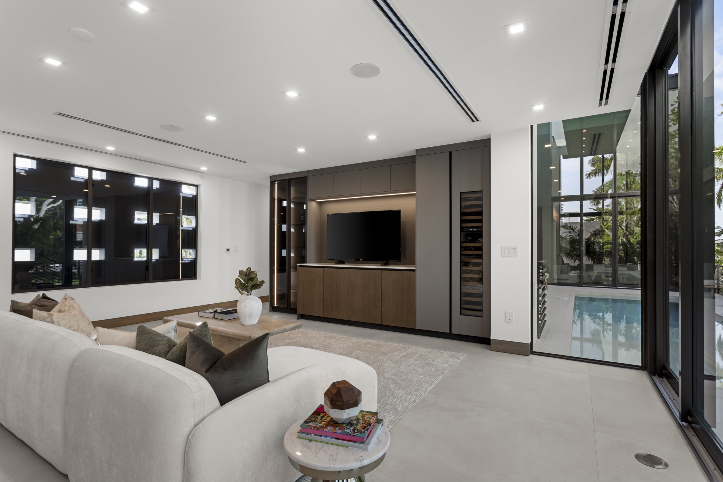 Family room at Fair Isle Residence opening directly toward the pool