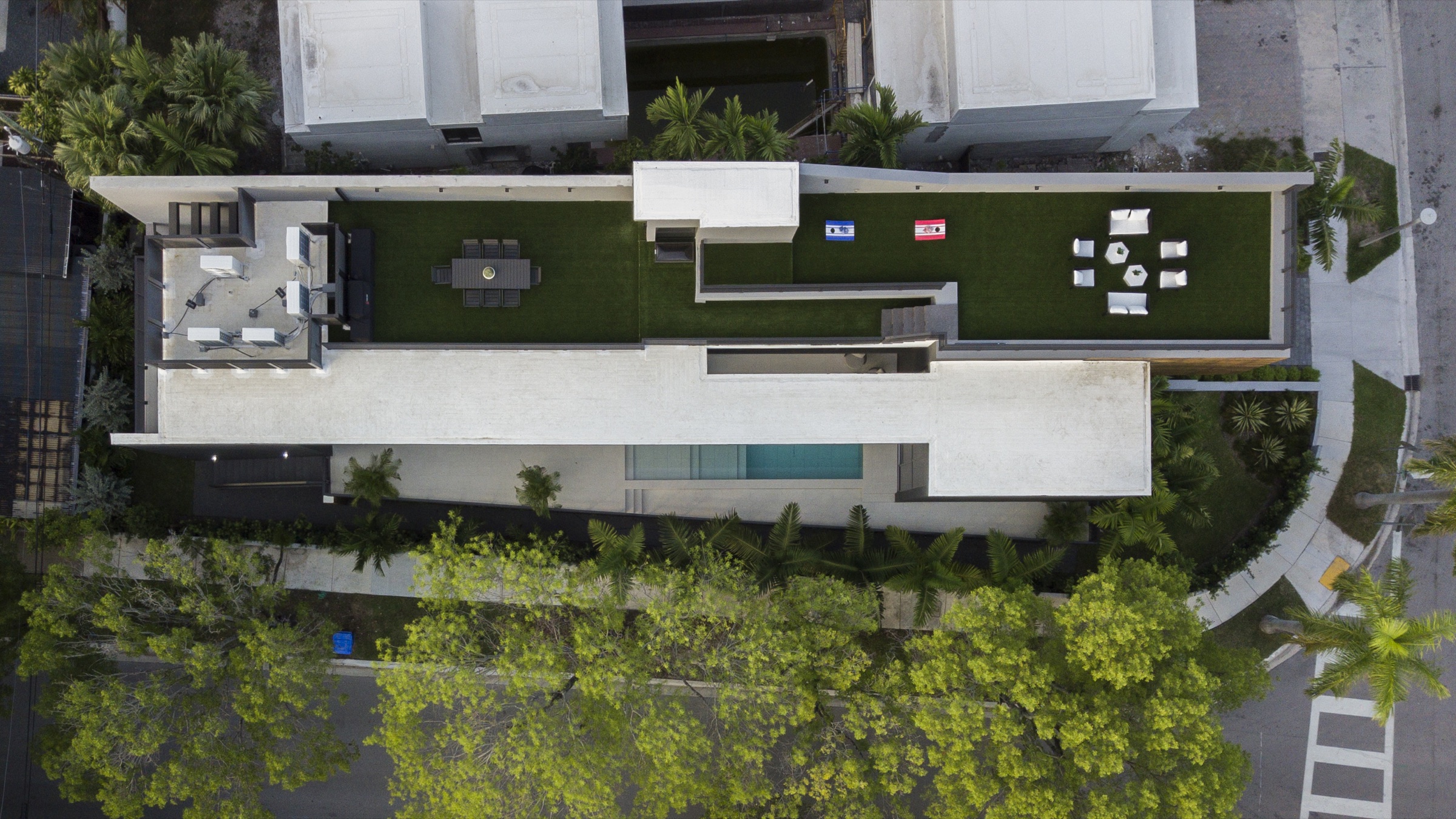 Aerial view of the planted roof, pool court and layered gardens of Fair Isle Residence in Coconut Grove