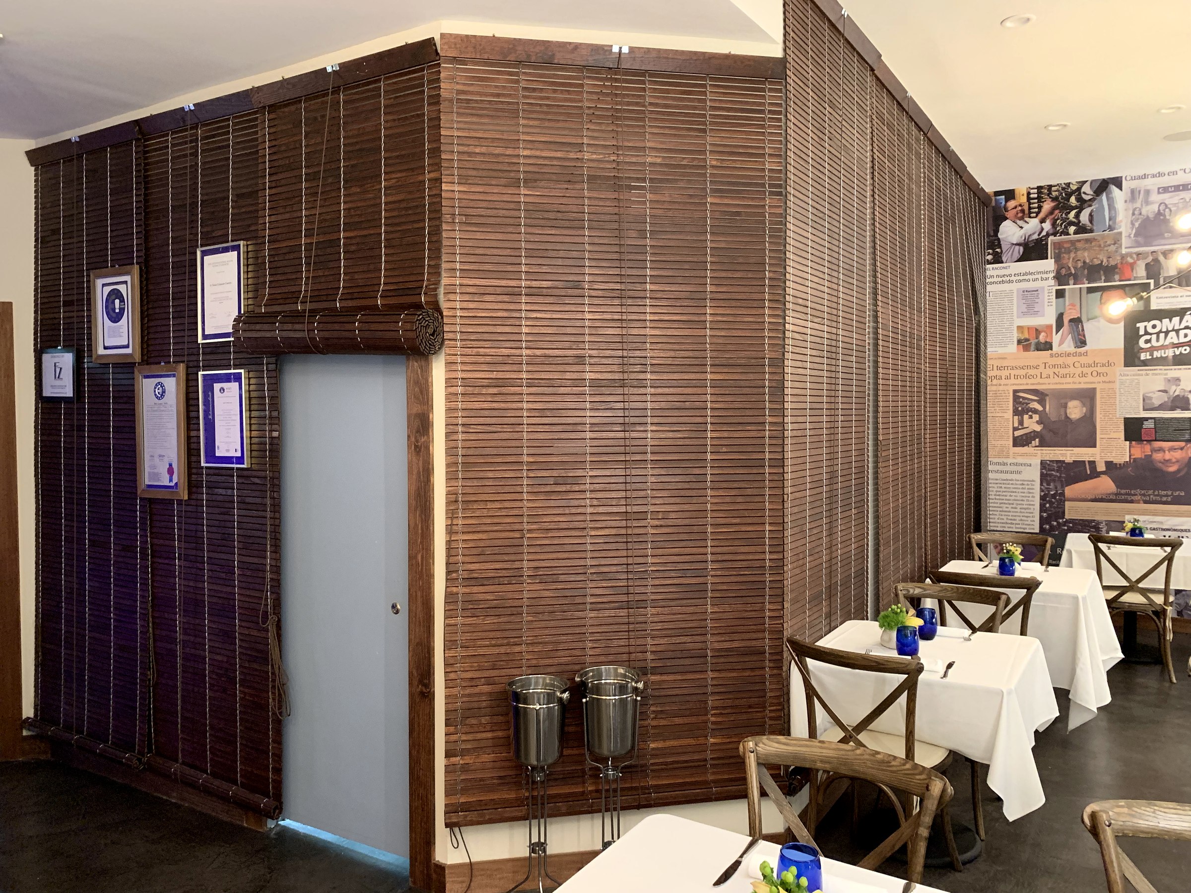 Dark timber screen wrapping an interior volume at Pairings Restaurant in Miami